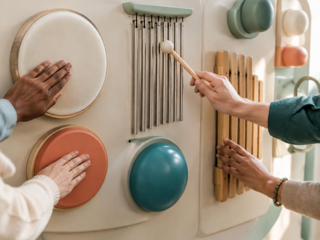 Concept visualization of hands engaging with gentle rhythm and sound elements